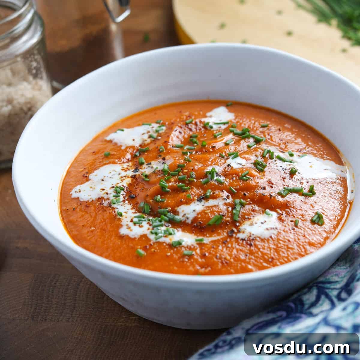 Photo of a bowl of tomato, lentil and squash soup
