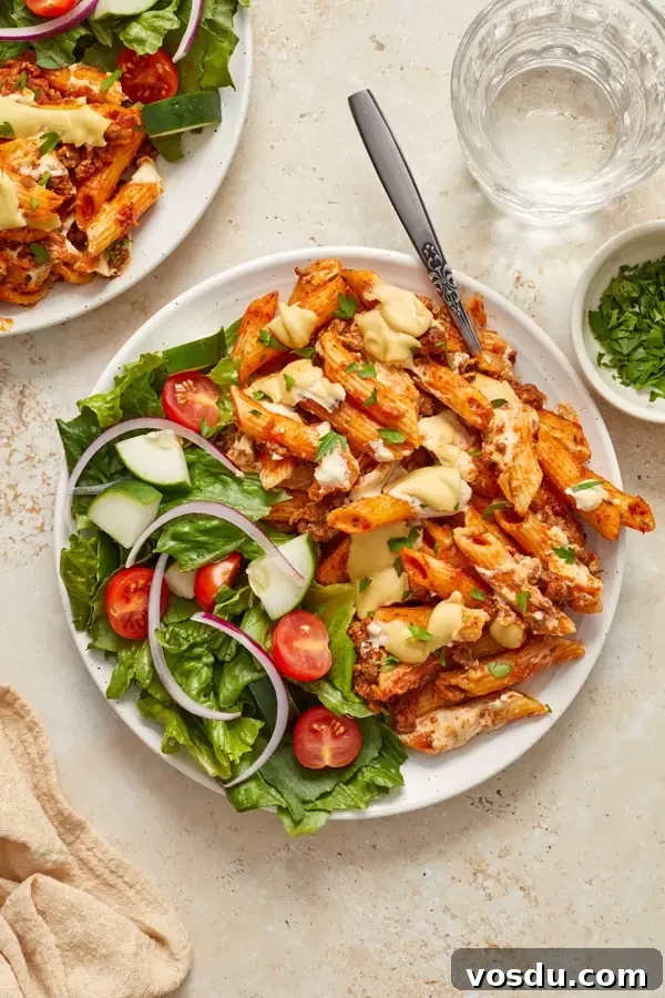 Dairy-Free Baked Ziti with Creamy Cashew Sauce 2 A plate filled with Dairy Free Baked Ziti and salad.