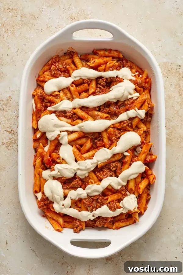 Dairy-Free Baked Ziti with Creamy Cashew Sauce 5 Unbaked Dairy Free Ziti in a white casserole dish.