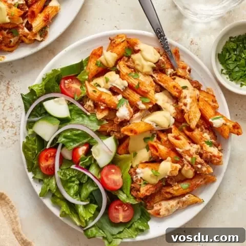 Dairy-Free Baked Ziti with Creamy Cashew Sauce 8 A plate filled with Dairy Free Baked Ziti and salad.