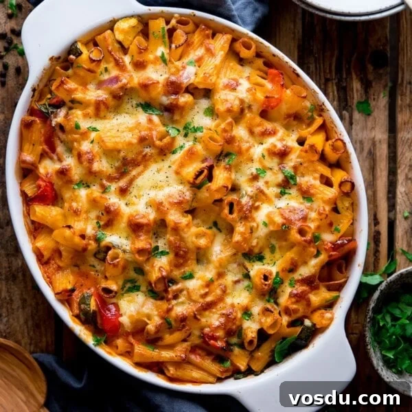 Creamy Mushroom Pasta Recipe with Garlic and Parmesan 6 square image of vegetable pasta bake in a white dish