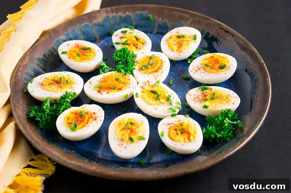 boiled eggs on a blue plate with yellow towel