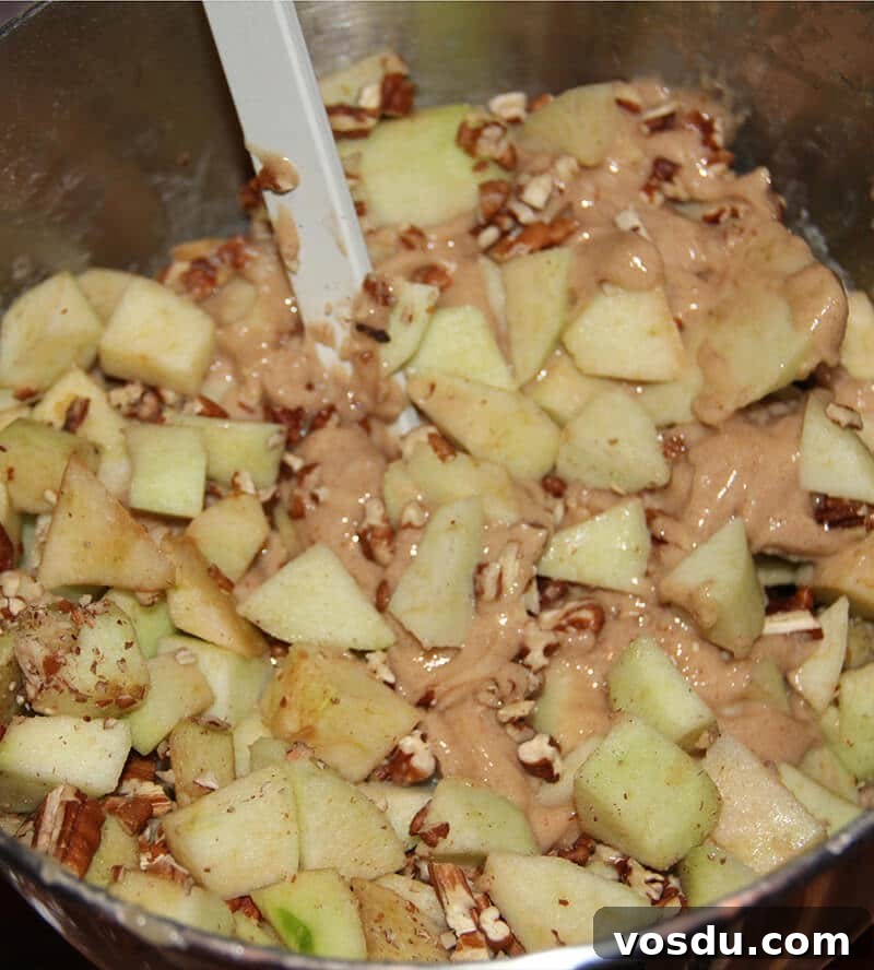 Decadent Caramel Apple Cake Recipe with Brown Sugar Glaze 4 Caramel Apple Cake apples and nuts in bowl