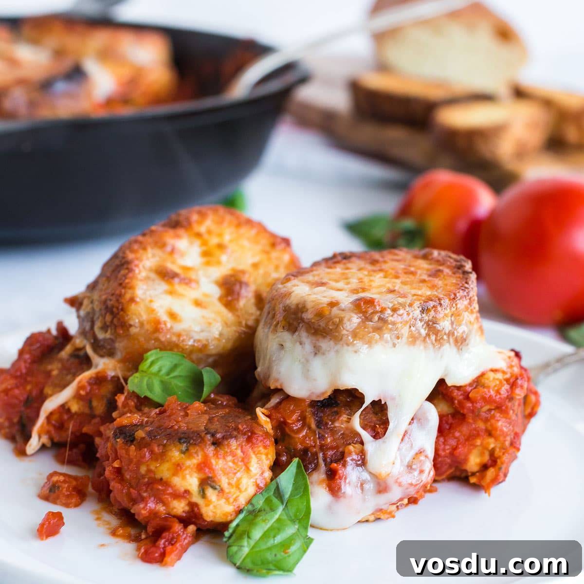 Cheesy Chicken Meatball Casserole with Tomato Basil Sauce 10 Plate of meatball sub casserole with basil garnish