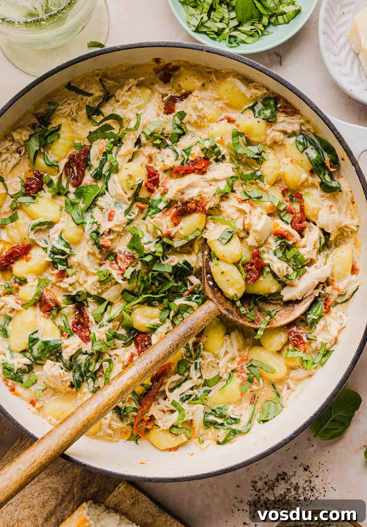 This EASY One Pan Marry Me Chicken and Gnocchi is the perfect weeknight meal! Pillowy soft gnocchi and tender chicken simmered together in a creamy sun dried tomato and parmesan sauce in just 20 minutes!  