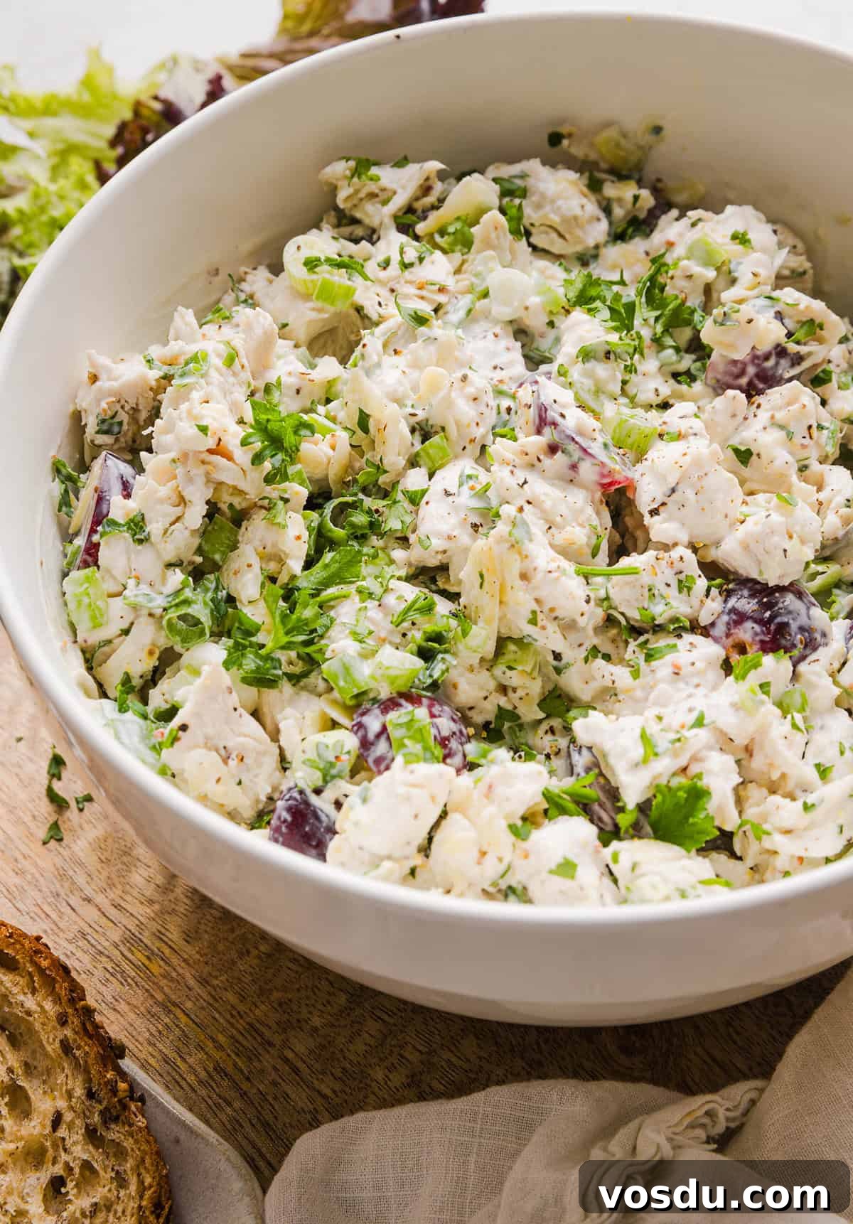 This Healthy Chicken Salad is creamy, fresh and packed with protein! Made with tender chicken, Greek yogurt in place of mayo, crunchy celery, grapes, and sliced almonds for a delicious, easy lunch or meal prep option you'll make on repeat!