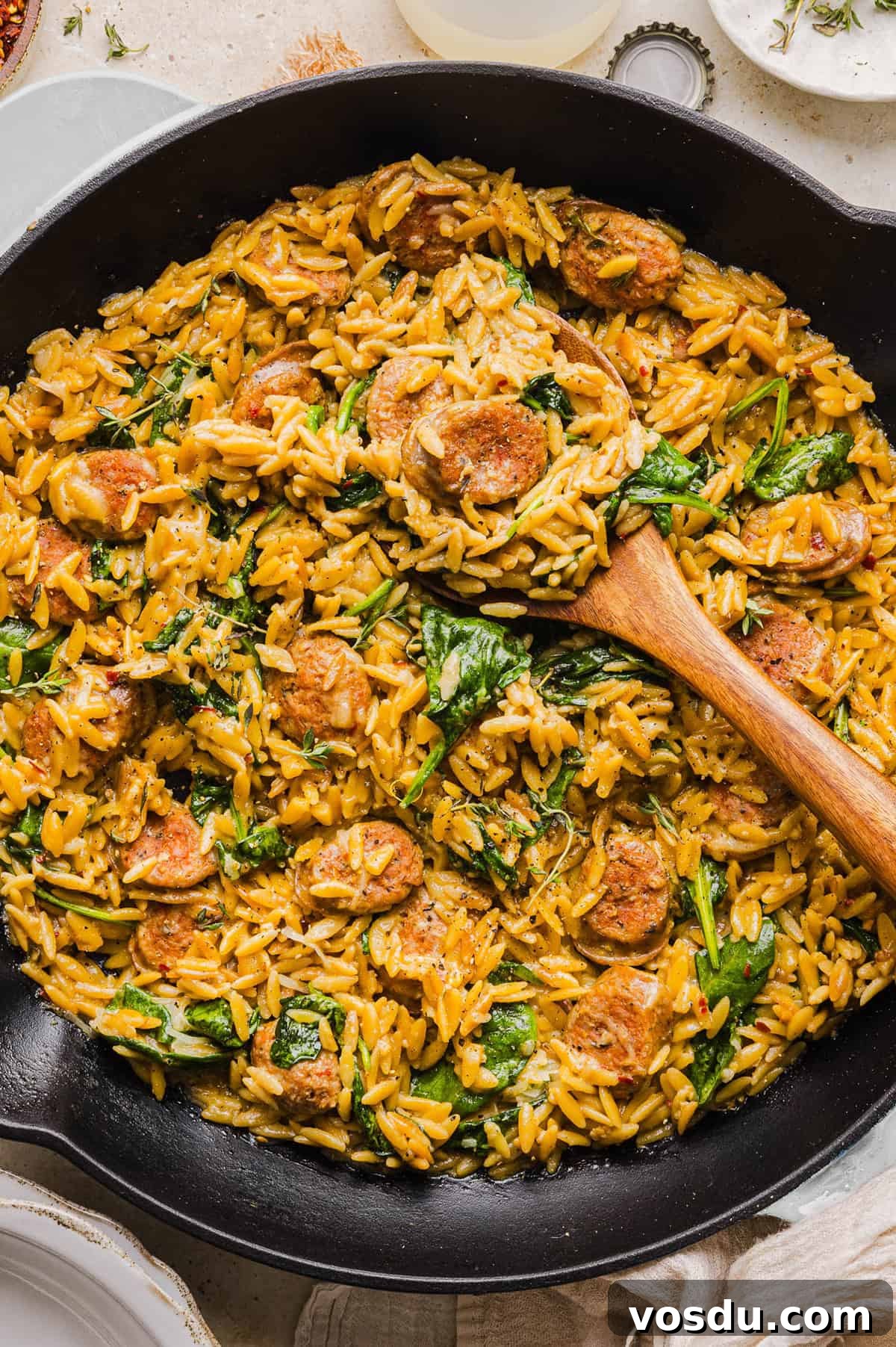 This Creamy Chicken Sausage Orzo Skillet is the perfect weeknight meal loaded with flavorful chicken sausage, tender orzo, tons of garlic and leafy spinach easily made in just 20 minutes all in one pan!  