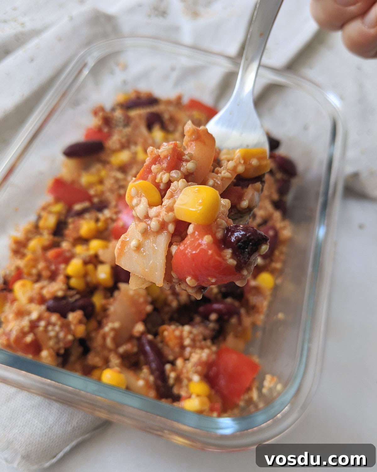 Mexican Red Bean and Quinoa Casserole for Meal Prep 2 fork full of mexican quinoa casserole