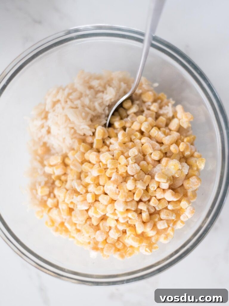 Mixing bowl with corn and rice in it.