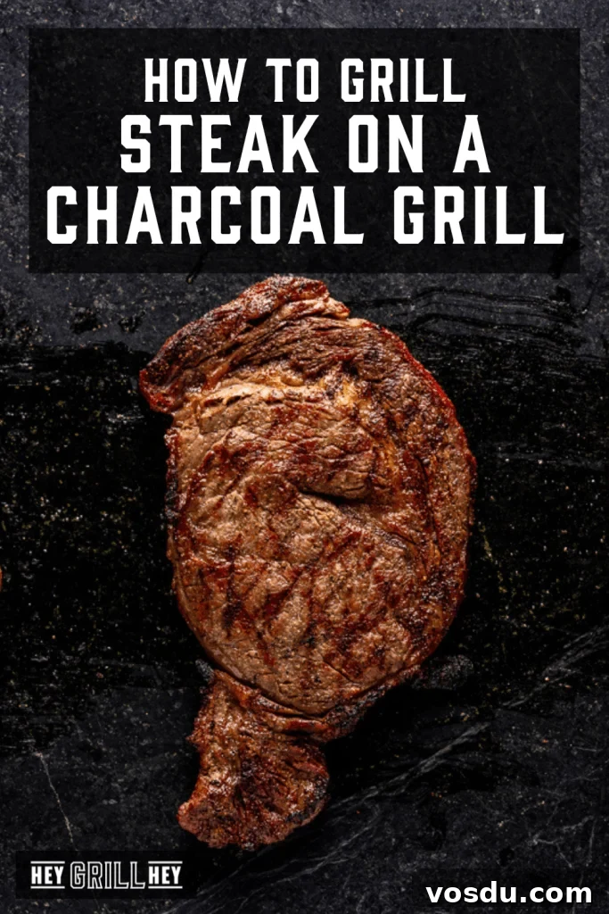 Grilled steak cooked on a charcoal grill.