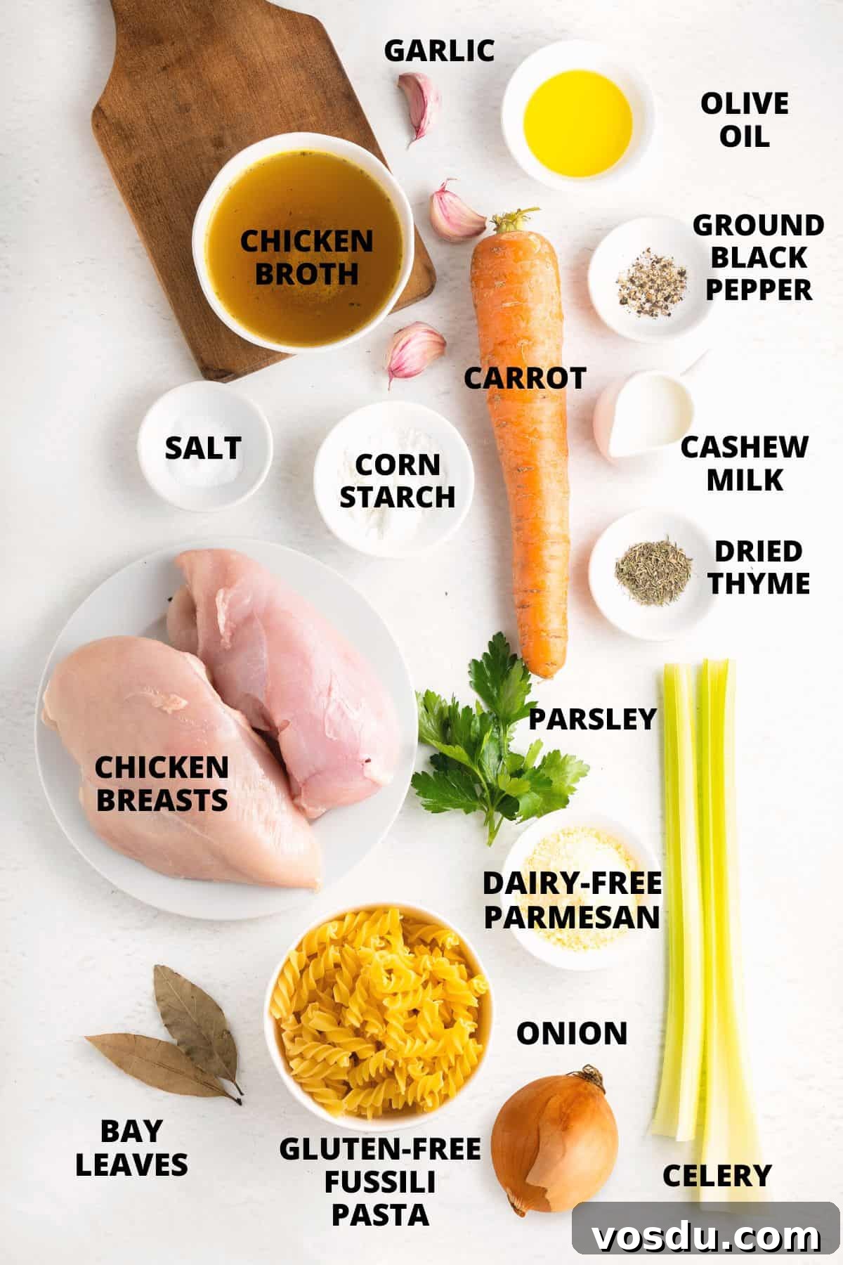 Gluten-Free Chicken Noodle Soup (Dairy-Free) Ingredients required for gluten free chicken noodle soup on marble board.
