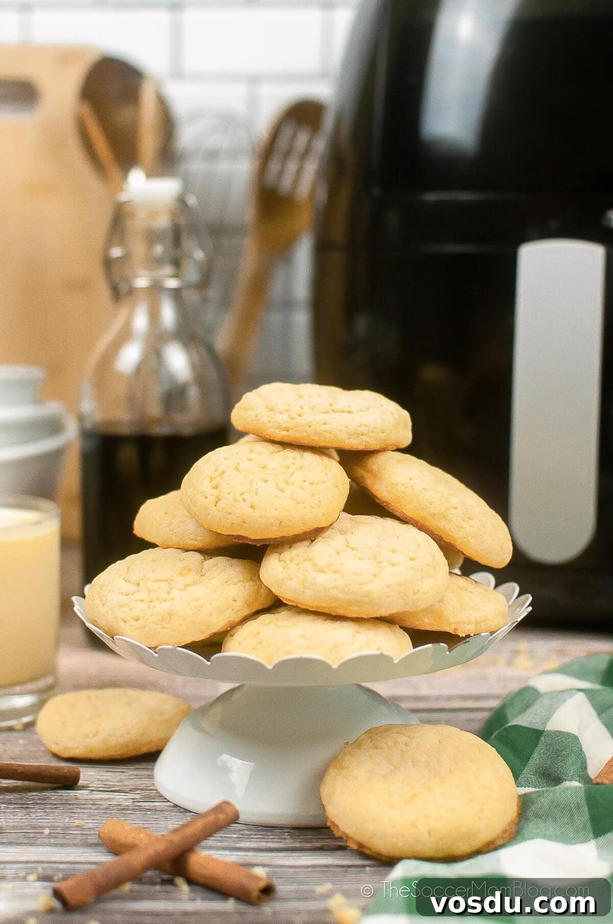 Air Fryer Eggnog Cookies Recipe for Holiday Baking 6 plate of air fryer eggnog cookies with supplies in background
