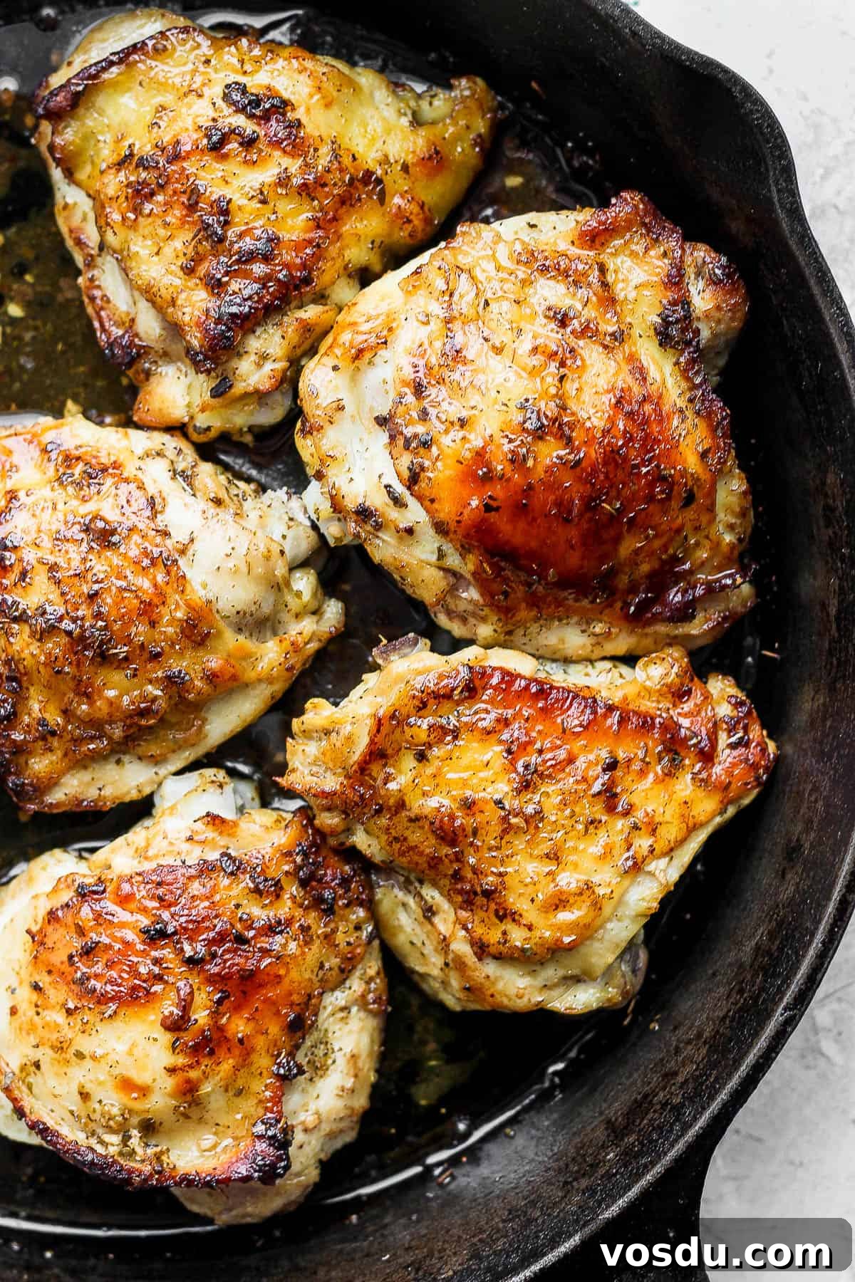Greek-Style Chicken Marinade for Juicy, Flavorful Grilled Chicken 8 5 seared chicken thighs in a cast iron pan.