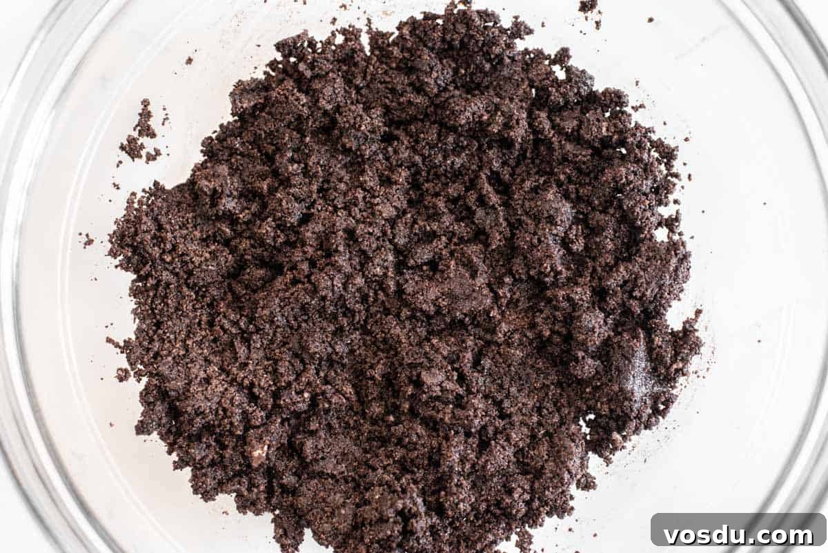 Decadent Oreo Cookie Tart Recipe 5 Oreo crust in glass bowl.