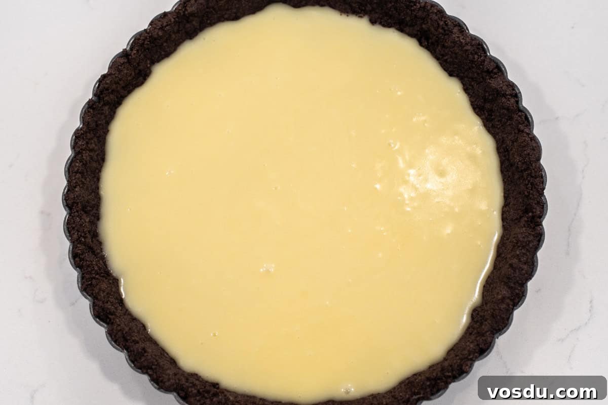 Decadent Oreo Cookie Tart Recipe 9 White chocolate ganache in tart.