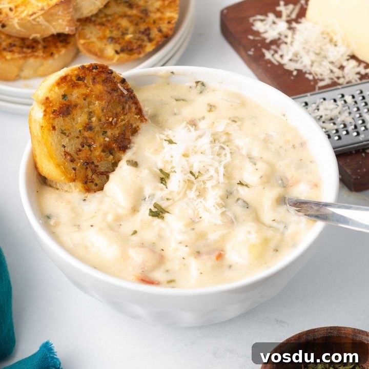 15 Quick Rotisserie Chicken Dinners for Busy Weeknights 10 A bowl of Chicken Gnocchi Soup served with garlic bread