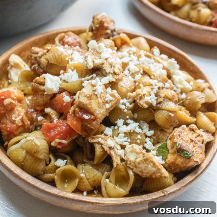 15 Quick Rotisserie Chicken Dinners for Busy Weeknights 9 Bowl of shell pasta with tomatoes, feta cheese, and balsamic vinegar