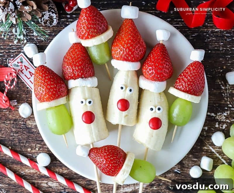 Festive Christmas Fruit Kabobs: Colorful Holiday Skewers 2 Easy and healthy Christmas fruit idea! Christmas Kabobs! These simple fruit Santas and strawberry Santa hats with grapes make a festive addition to any party, holiday celebration, gathering, or fun playdate!