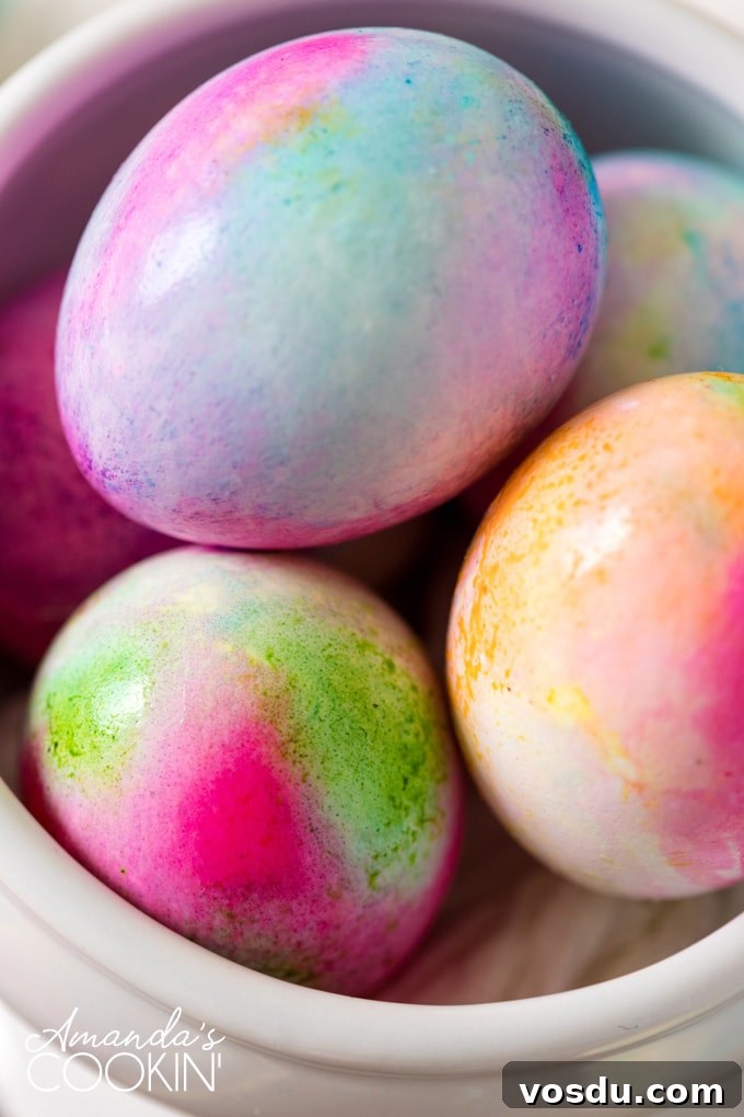 Tie Dye Easter Eggs are super fun for kids to get creative and create tons of different beautifully colored Easter eggs! Try these tie dye method this year! dyed easter eggs