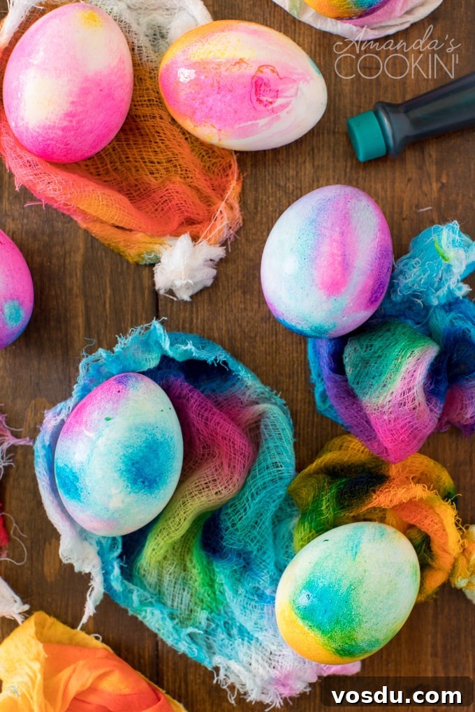 Tie Dye Easter Eggs are super fun for kids to get creative and create tons of different beautifully colored Easter eggs! Try these tie dye method this year! eggs that have been dyed in cheesecloth