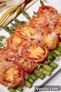 Chilled Asparagus and Tomato Salad with Lemon Vinaigrette 9 Easy asparagus recipe on a white platter with a striped napkin