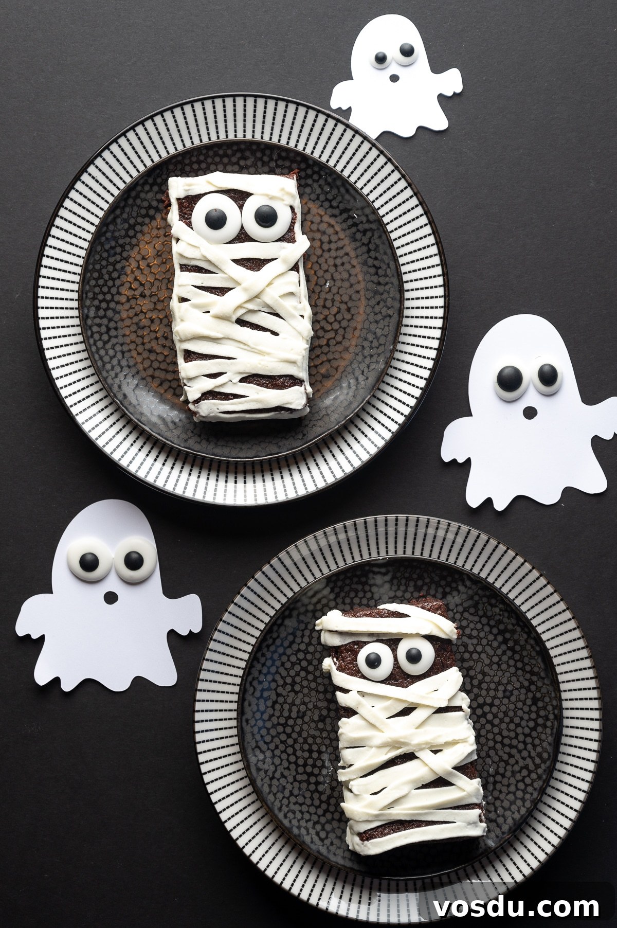 Halloween Mummy Sugar-Free Brownies — Gluten-Free Low-Carb Treats 7 Sugar free brownie with googly eyes and frosting applied in strips to look like bandages on a black background