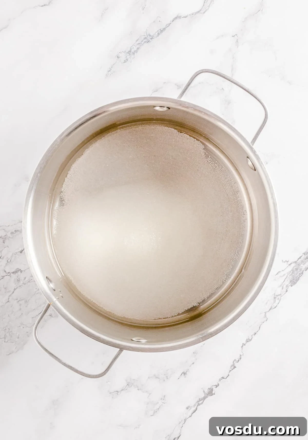 Ingredients in a saucepan for making simple syrup
