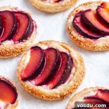 up close shot of tarts on baking paper.