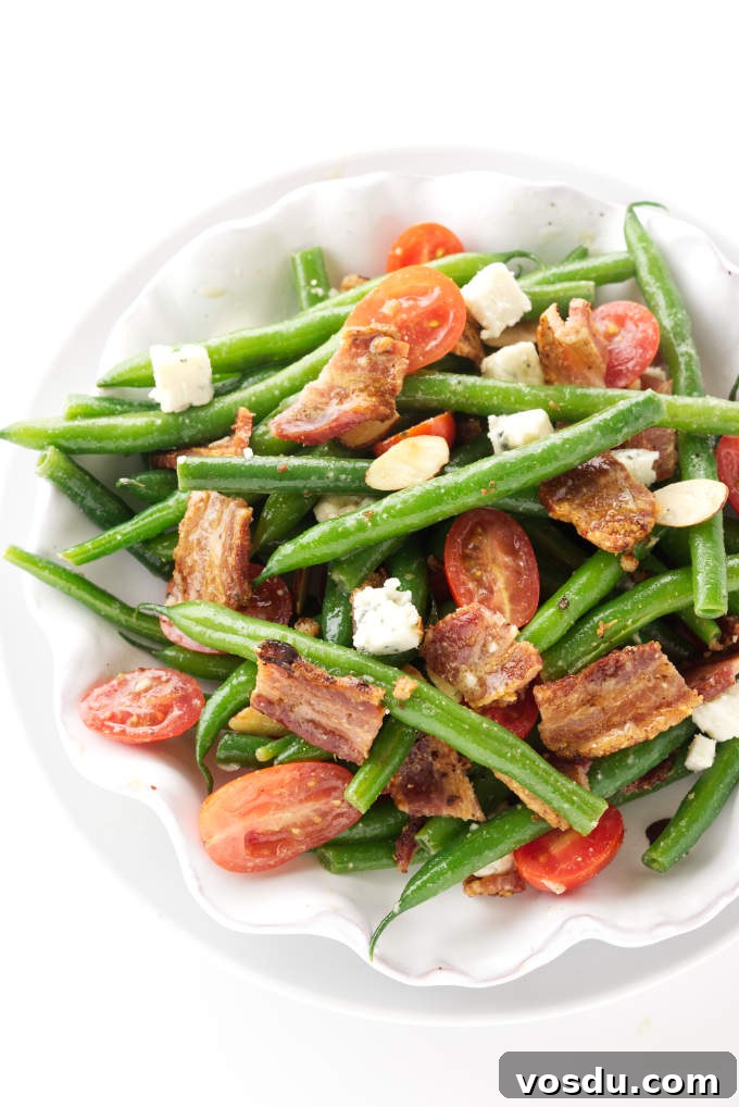 Crispy Bacon Tomato Green Bean Salad Recipe 7 A dish of green bean salad with bacon and tomatoes.
