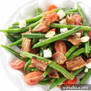 Crispy Bacon Tomato Green Bean Salad Recipe 8 A dish of green bean salad with bacon and tomatoes.