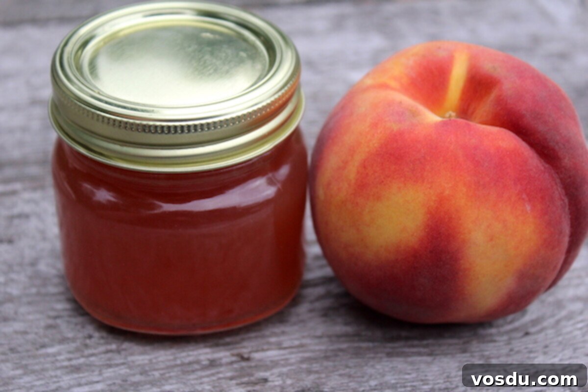 Homemade Peach Jelly Canning Recipe: Step-by-Step Guide 7 Home canned peach jelly in a jar