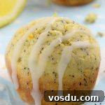 Lemon Poppy Seed Muffins drizzled with icing.
