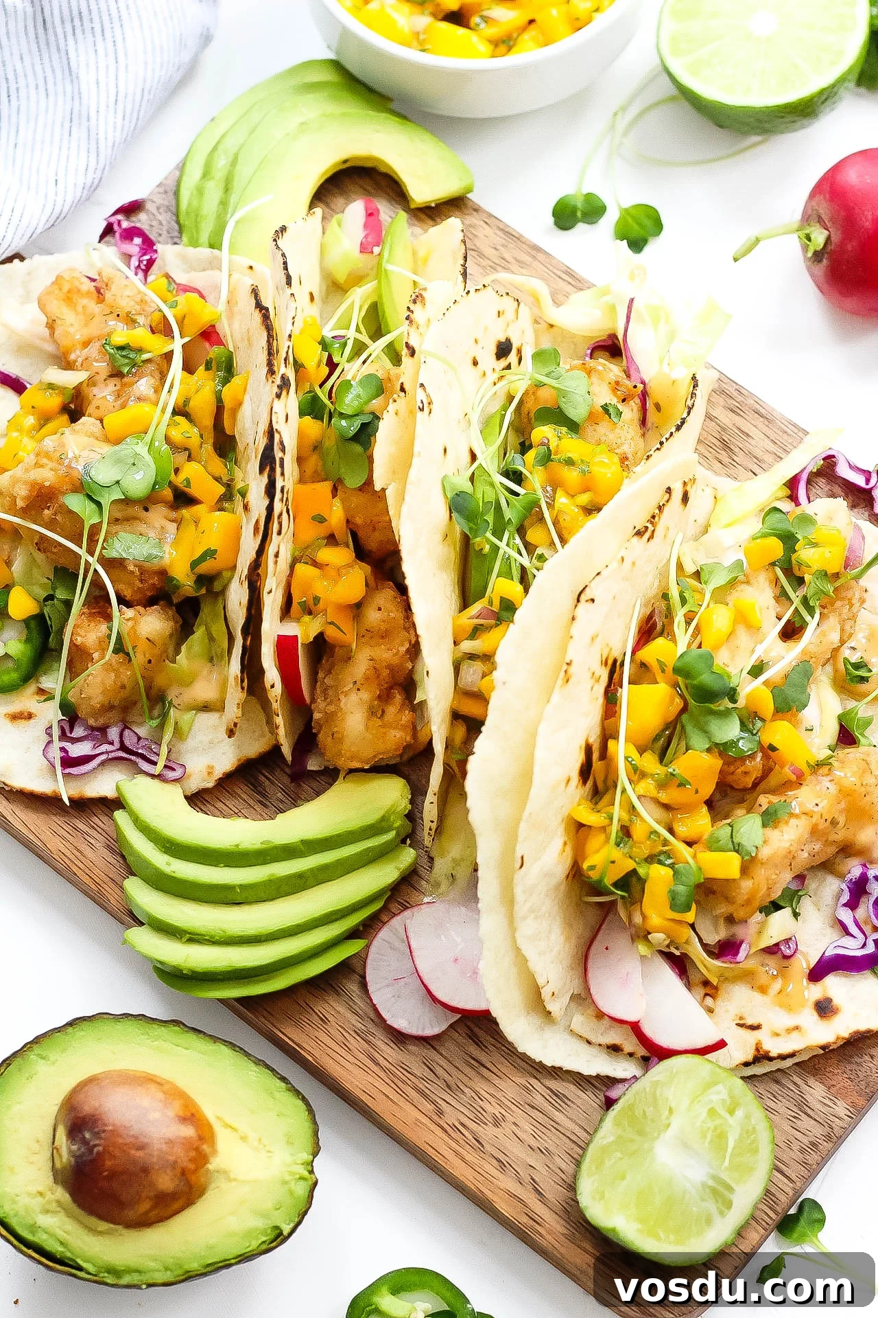 Paleo Fish Tacos with Mango Salsa — Gluten-Free in 25 Minutes 3 These grain free tacos is a fun and quick breaded fish recipe with easy mango salsa! Paleo fish tacos are totally gluten-free, family friendly, and even Whole30 if you skip the grain free tortilla and go for a lettuce wrap fish taco! Either way, these paleo fish tacos will be a summer favorite! #paleofishtacos #grainfreetacos #paleofish