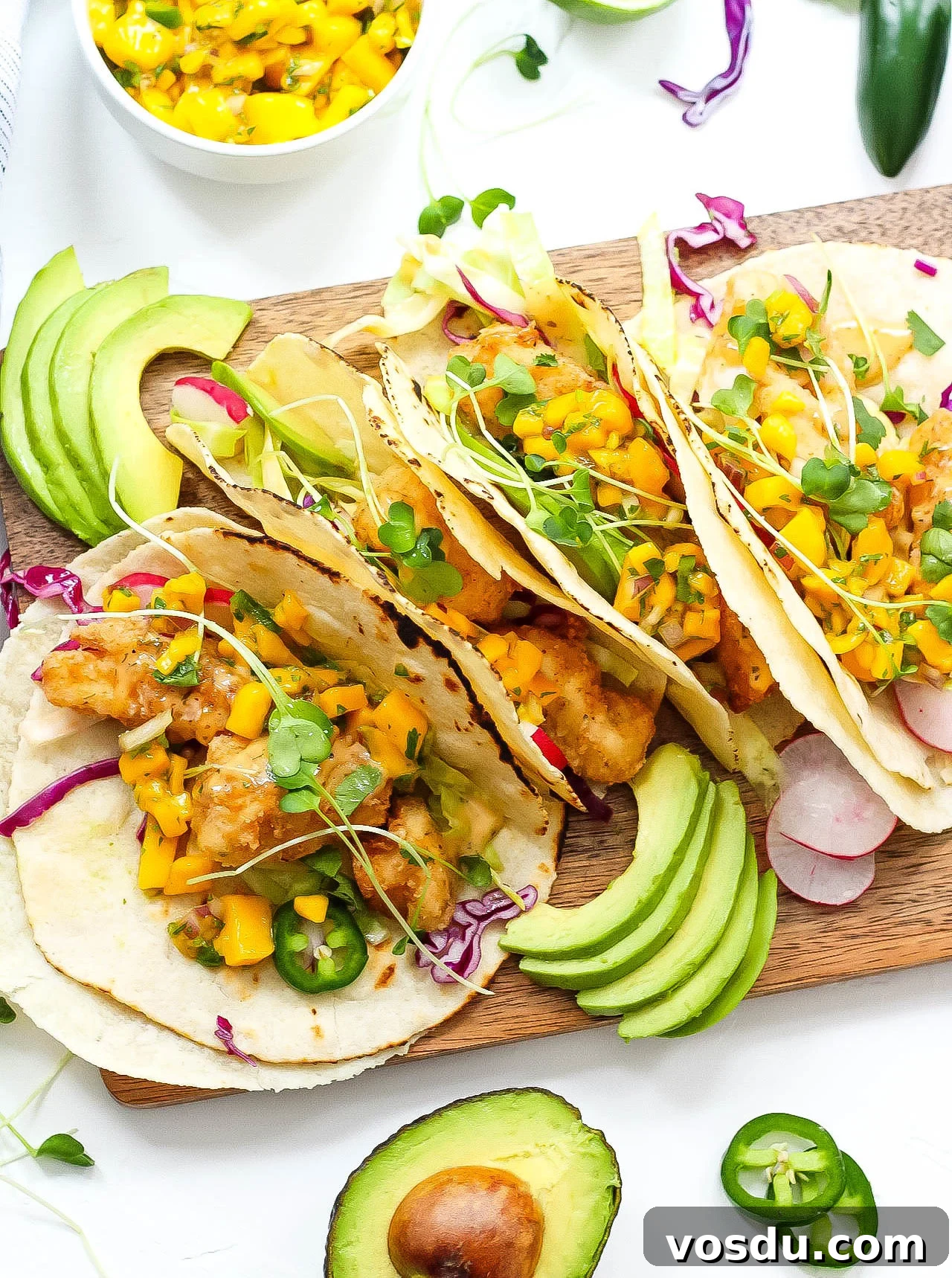 Paleo Fish Tacos with Mango Salsa — Gluten-Free in 25 Minutes 4 These grain free tacos is a fun and quick breaded fish recipe with easy mango salsa! Paleo fish tacos are totally gluten-free, family friendly, and even Whole30 if you skip the grain free tortilla and go for a lettuce wrap fish taco! Either way, these paleo fish tacos will be a summer favorite! #paleofishtacos #grainfreetacos #paleofish