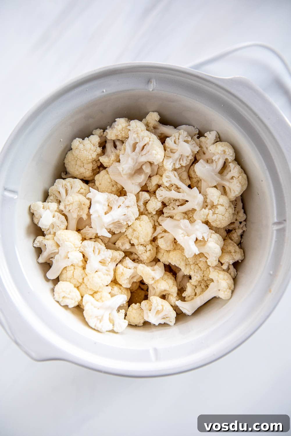 Slow-Cooker Whipped Cauliflower Recipe for Creamy Mash 6 fresh cauliflower pieces in slow cooker