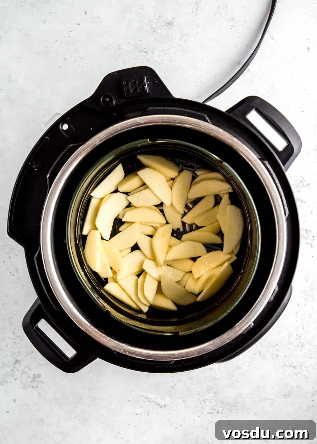 Crispy Cinnamon Air Fryer Apples Recipe 7 buttery apples in air fryer basket