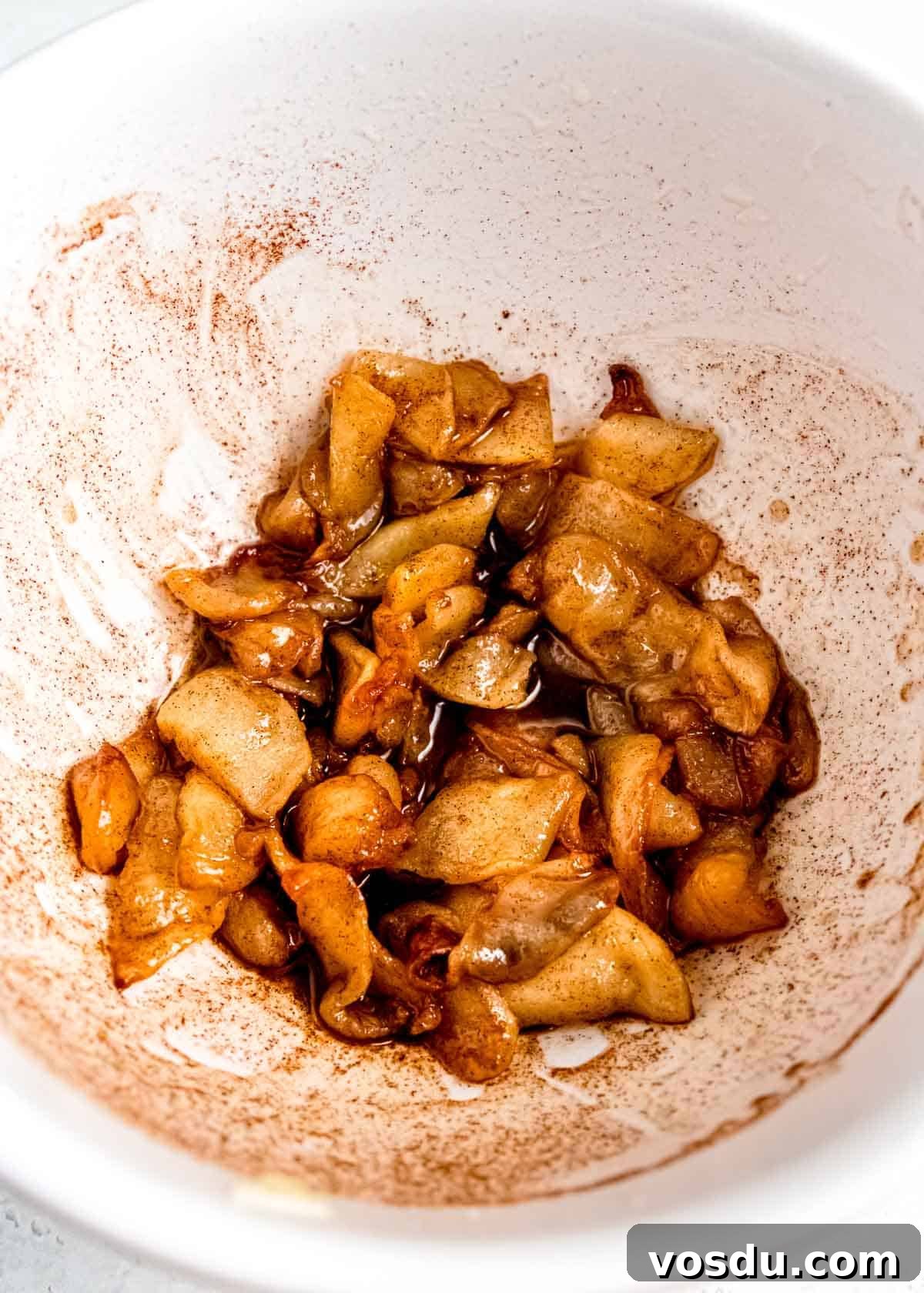 Crispy Cinnamon Air Fryer Apples Recipe 10 seasoned apples in bowl