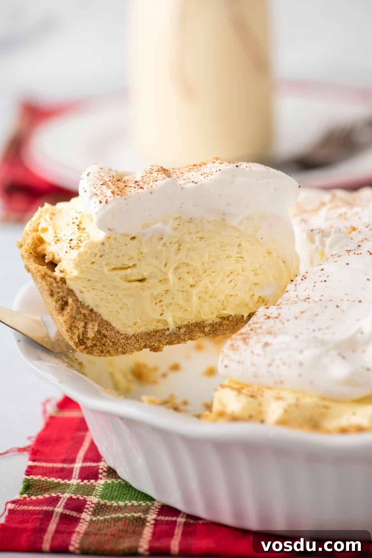 A slice of eggnog pie being served