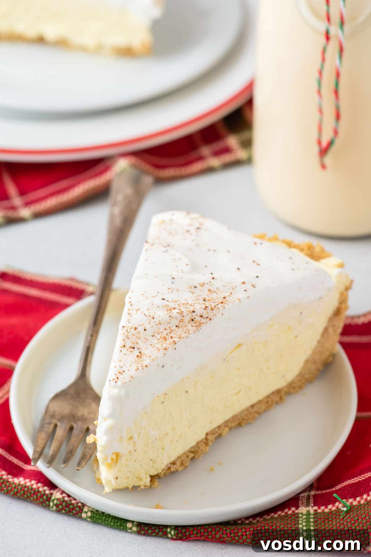 A slice of no bake eggnog pie on a plate