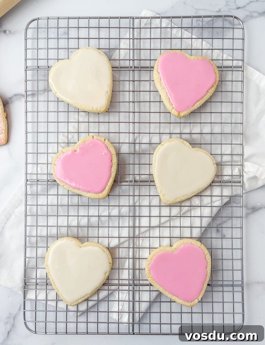 Almond Flour Shortbread Cookies Recipe — Buttery Gluten-Free Treat 2 Iced almond flour shortbread cookies on a cooling rack