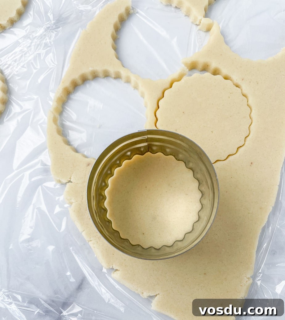 Almond Flour Shortbread Cookies Recipe — Buttery Gluten-Free Treat 6 Cookie dough rolled out and cut with a round fluted cookie cutter.