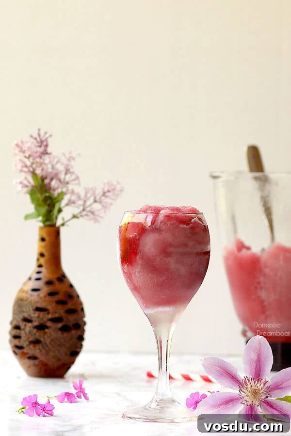 Piña Colada Without Syrup: Creamy Tropical Cocktail Recipe 5 Frozen wine slushie in wine glass surrounded by flowers