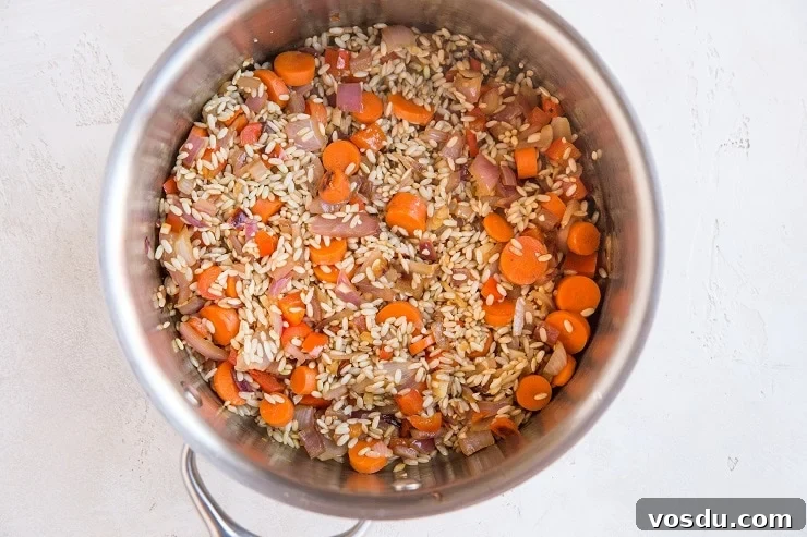 One-Pot Chicken Un-Fried Rice Recipe 5 Sauté the onion, carrots, garlic and rice