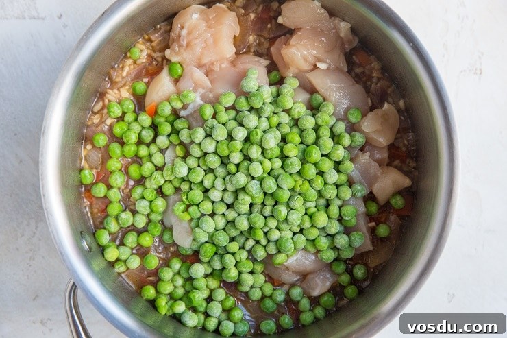 One-Pot Chicken Un-Fried Rice Recipe 6 Add the chicken and peas to the pot