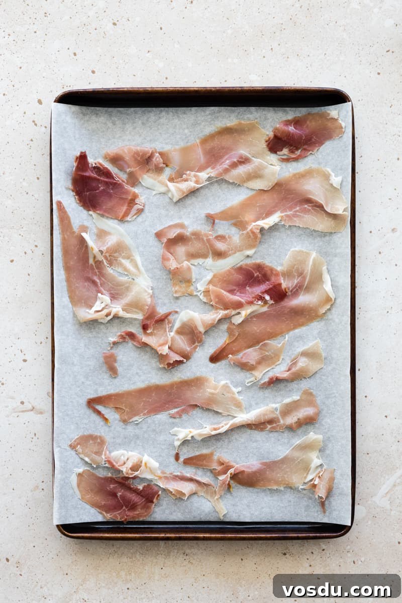 Peach and Prosciutto Salad with Burrata and Arugula 4 Prosciutto on a parchment paper-lined baking sheet.