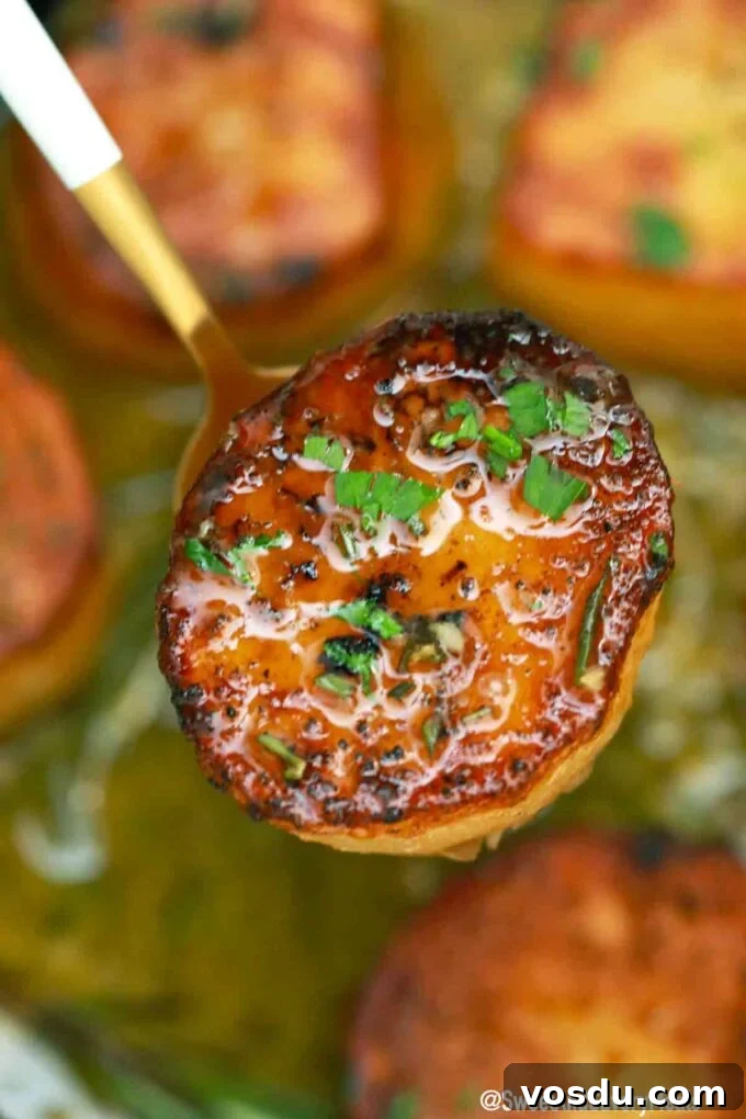Perfect Fondant Potatoes Recipe: Crispy Edges, Tender Centers 10 crispy and browned fondant potato on a fork