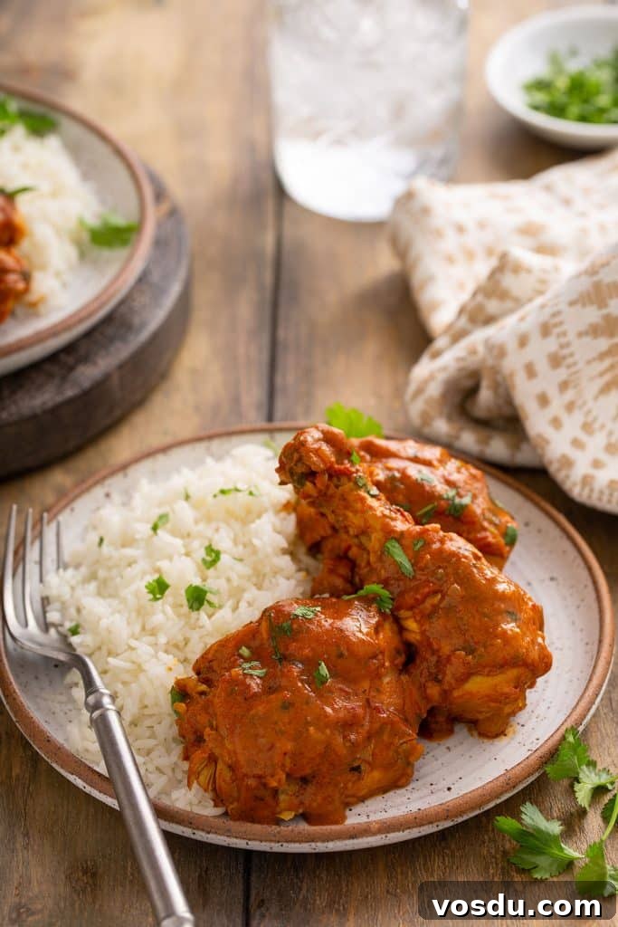 Chicken legs and thighs in a creamy Indian curry served with rice.