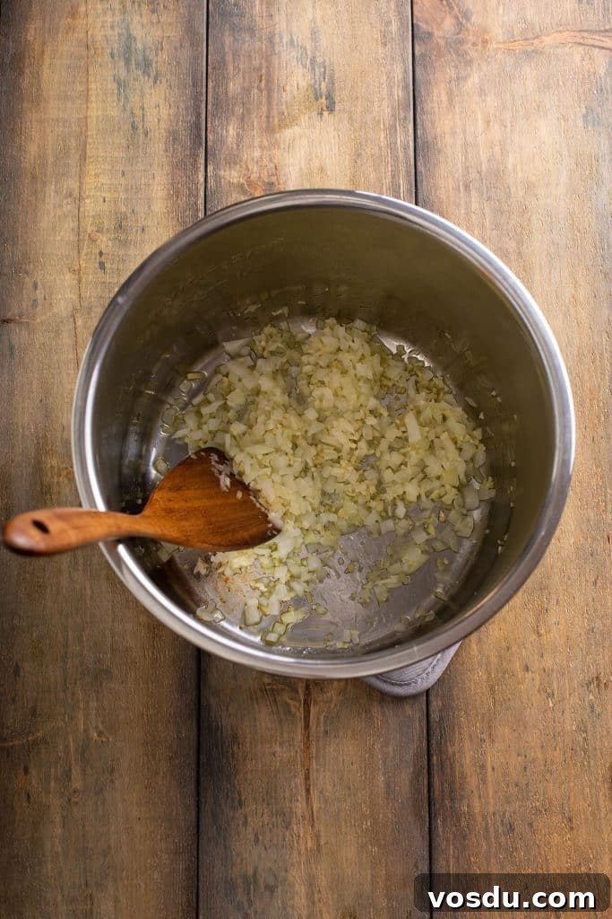Onion, garlic and ginger sautéing in an instant pot