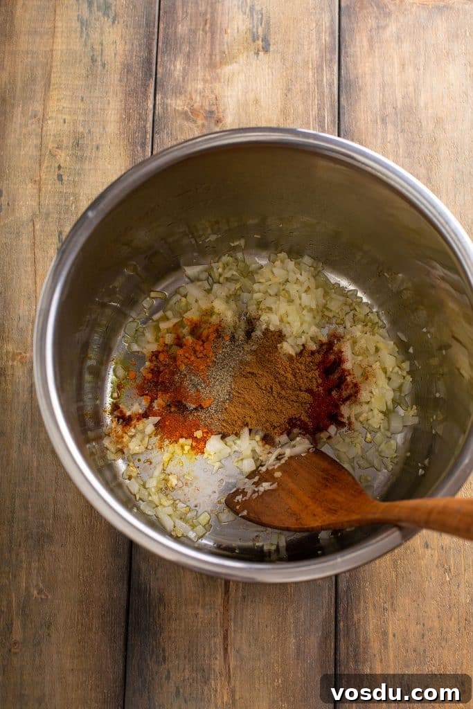 Onion, garlic and ginger with spices sautéing in an instant pot