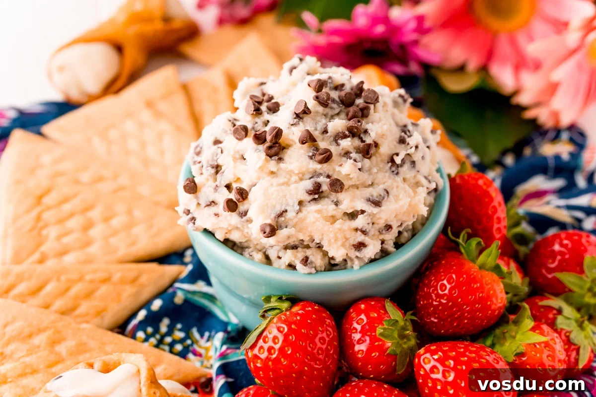 Mascarpone Cannoli Dip Recipe: Creamy Dessert Dip for Parties 4 Close up photo of cannoli dip with chocolate chips in a teal bowl.